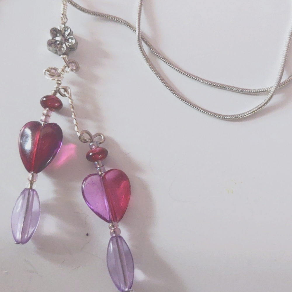 Red and purple beads accented with hand woven silver wire little silver accented